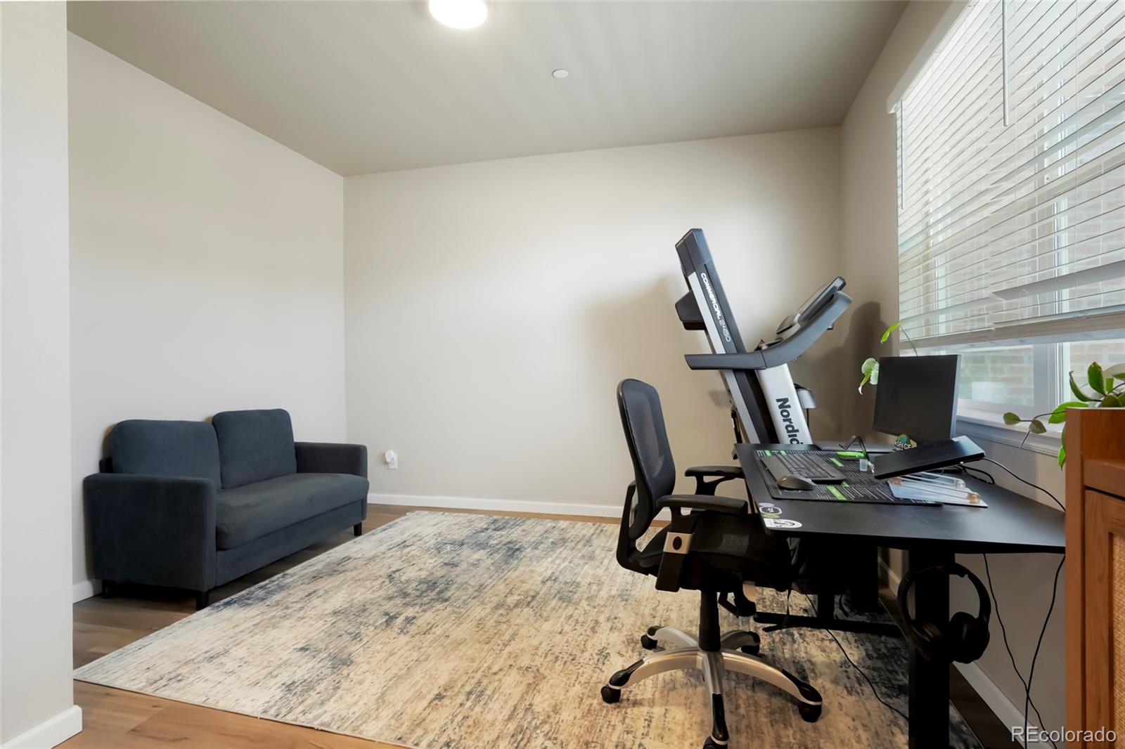 6974 Merseyside Lane Castle Pines, CO 80108 - Photo 4 of 27 a work room with furniture and a window