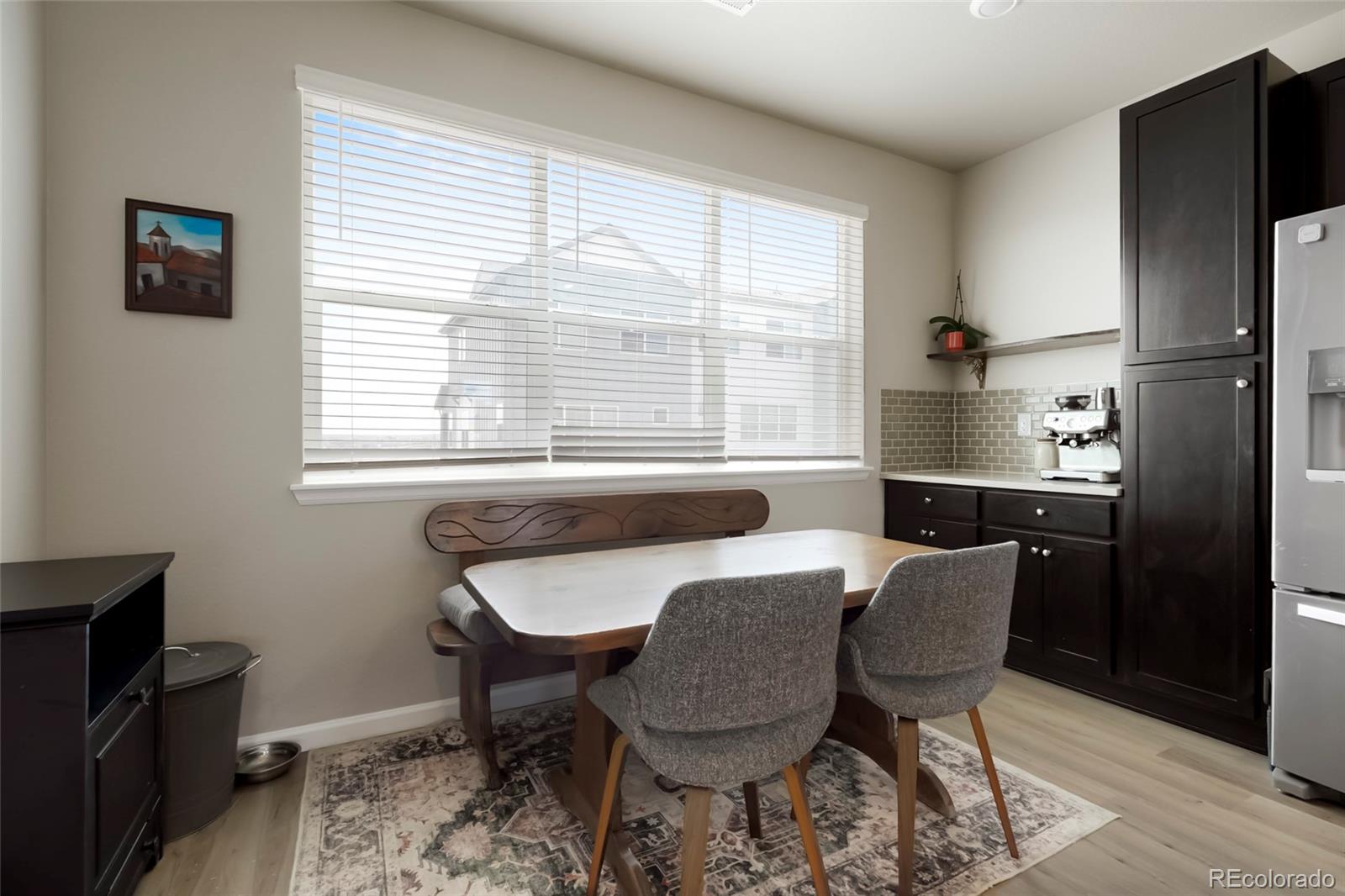6974 Merseyside Lane Castle Pines, CO 80108 - Photo 6 of 27 a dining room with furniture and window