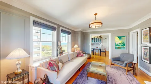 a living room with furniture and a table