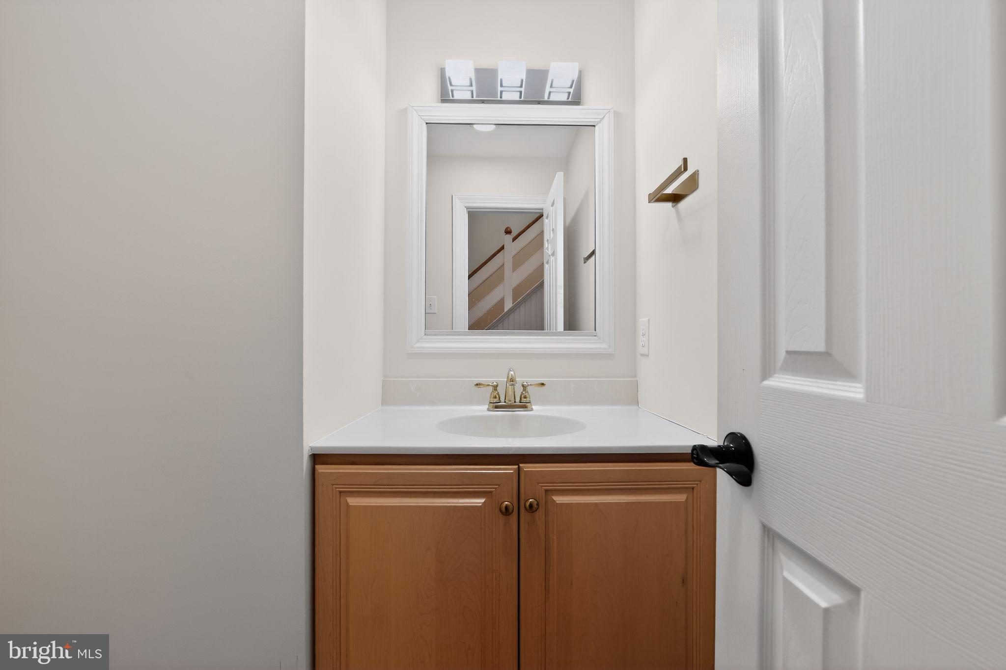 932 Hedgerow Court Blue Bell, PA 19422 - Photo 23 of 40 a bathroom with a sink and a mirror