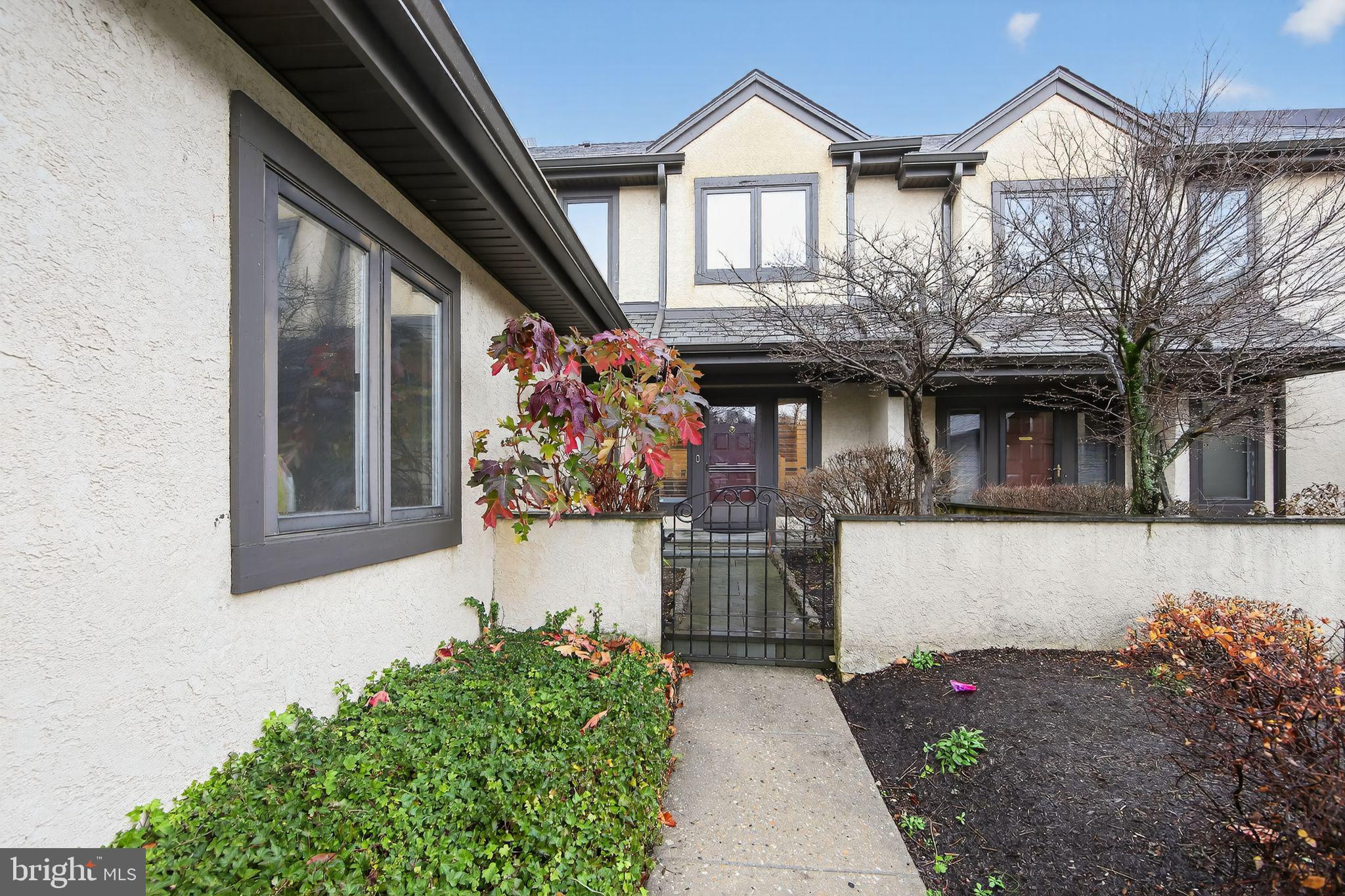 932 Hedgerow Court Blue Bell, PA 19422 - Photo 3 of 40 a front view of a house with a yard