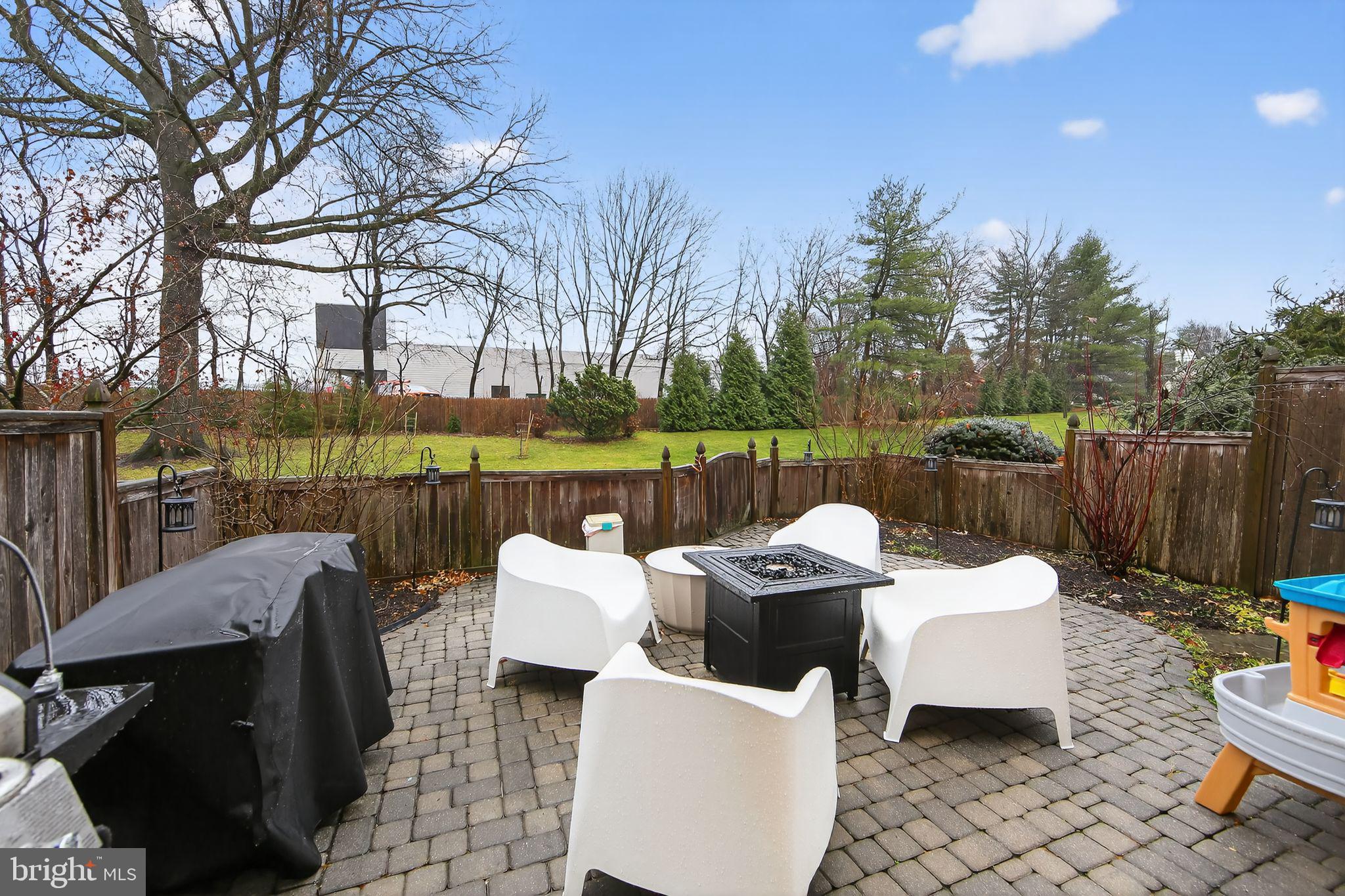 932 Hedgerow Court Blue Bell, PA 19422 - Photo 37 of 40 a wooden bench sitting in front of a house