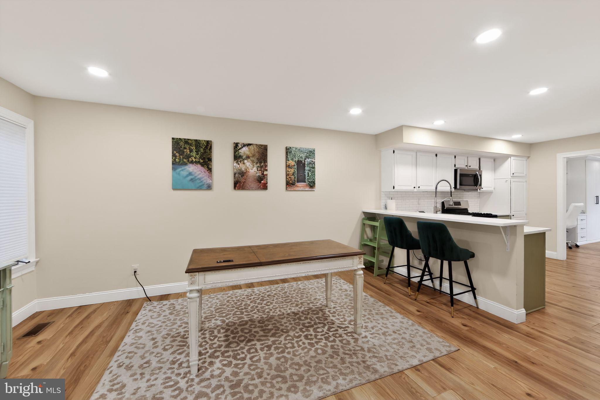 932 Hedgerow Court Blue Bell, PA 19422 - Photo 8 of 40 a living room with stainless steel appliances furniture a rug and a window