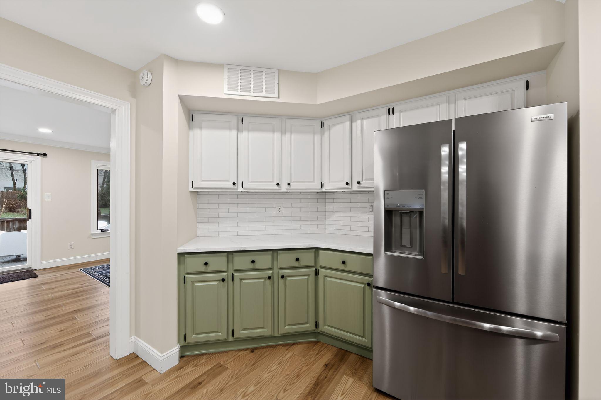 932 Hedgerow Court Blue Bell, PA 19422 - Photo 10 of 40 a kitchen with a refrigerator and a sink