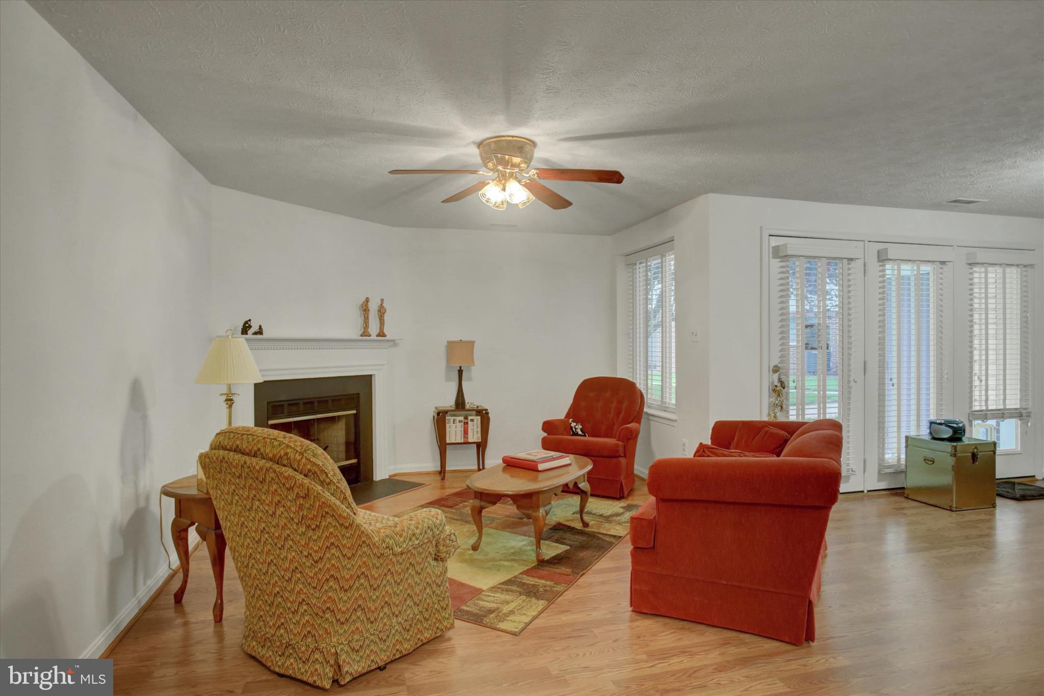 2108 Whitehall Road, Unit BC Frederick, MD 21702 - Photo 35 of 35 a living room with furniture a fireplace and a chandelier