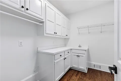 a bathroom with a bathtub a shower and a window