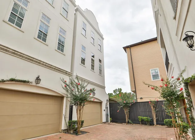 a vase of flowers sitting on a wall