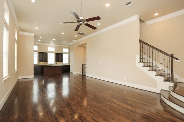 a view of a kitchen and a sink with wooden floor