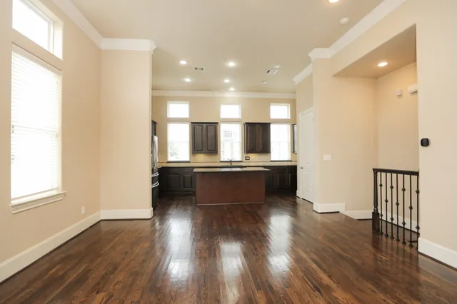 a view of kitchen with sink and refrigerator