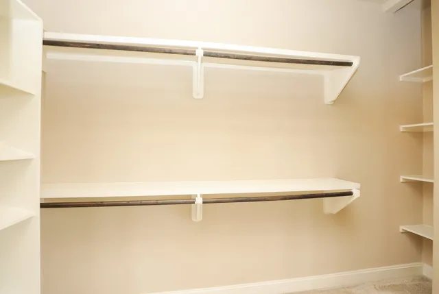 a view of a balcony with a yard