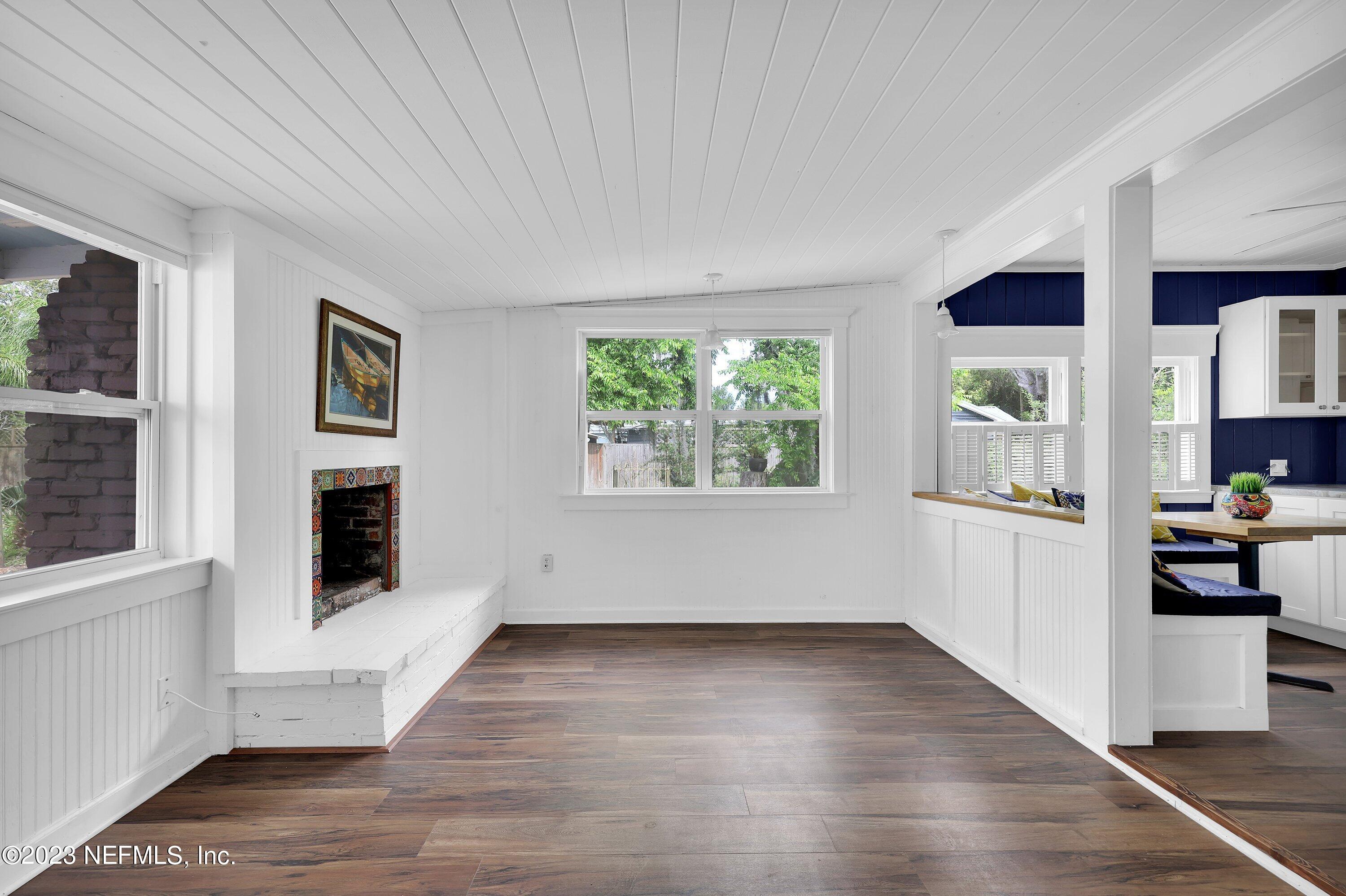 4 Florida Avenue St. Augustine, FL 32084 - Photo 11 of 52 a view of a kitchen with an empty room and wooden floor