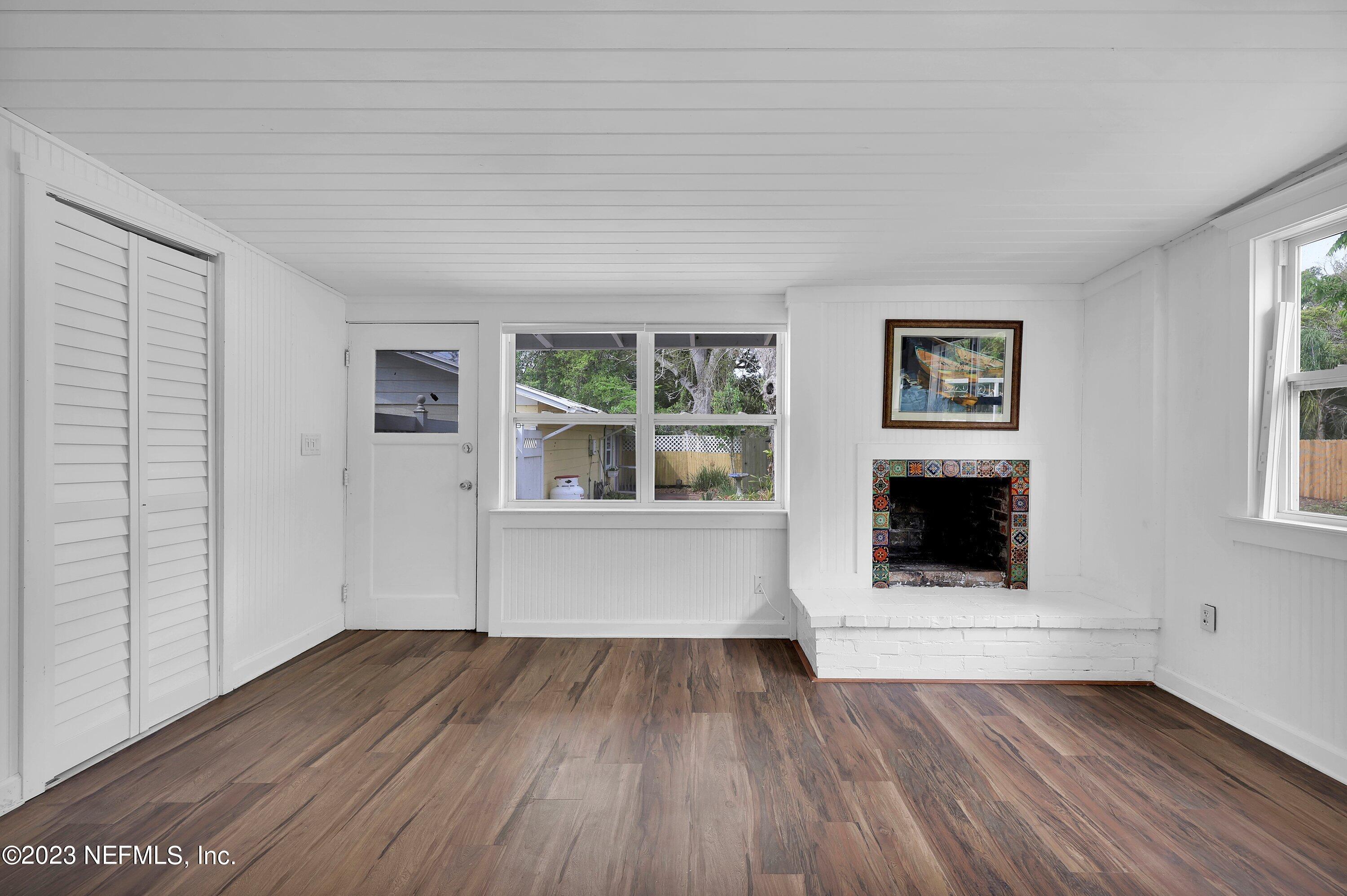 4 Florida Avenue St. Augustine, FL 32084 - Photo 12 of 52 a view of an empty room with wooden floor and a window