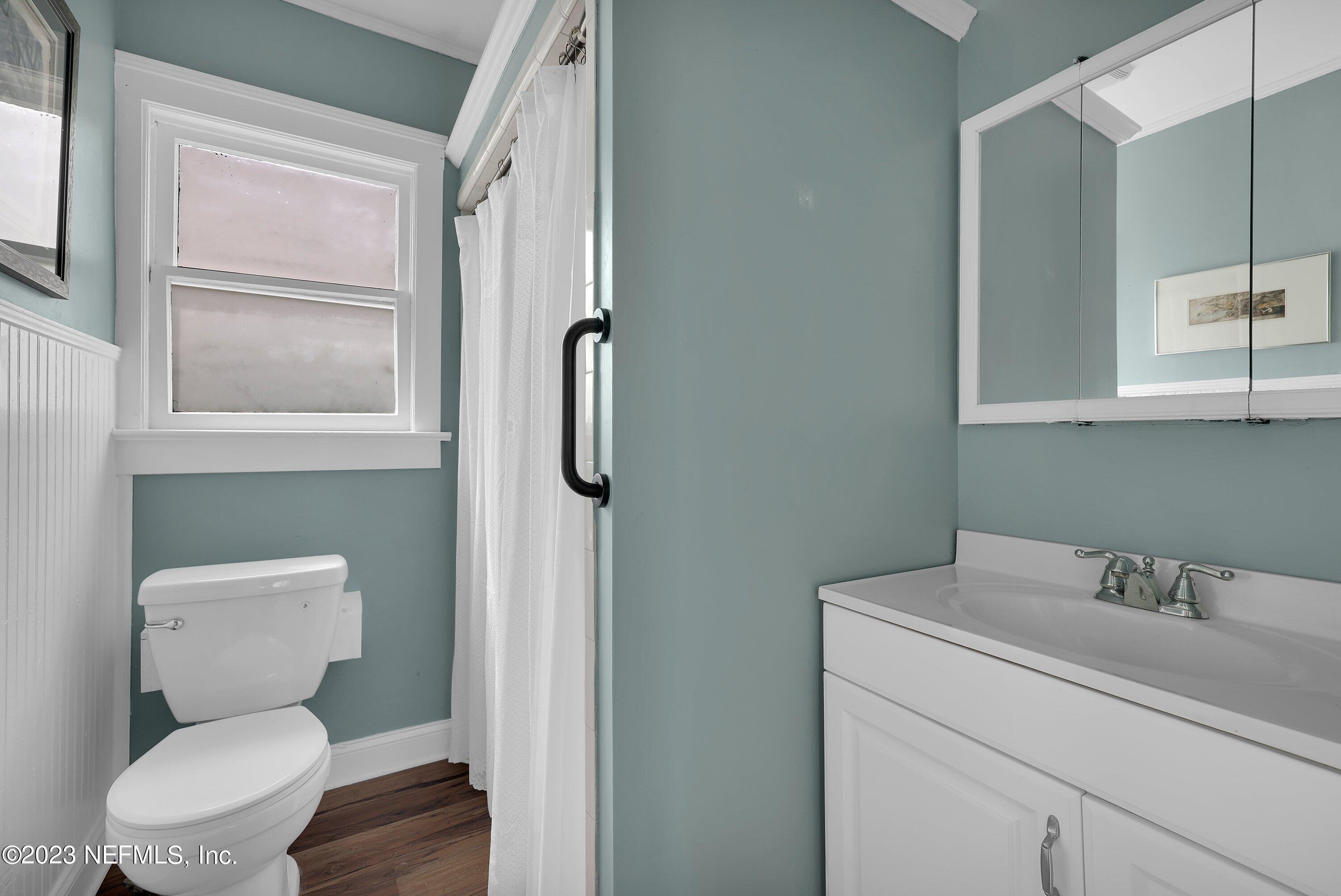 4 Florida Avenue St. Augustine, FL 32084 - Photo 16 of 52 a bathroom with a toilet sink a mirror and shower