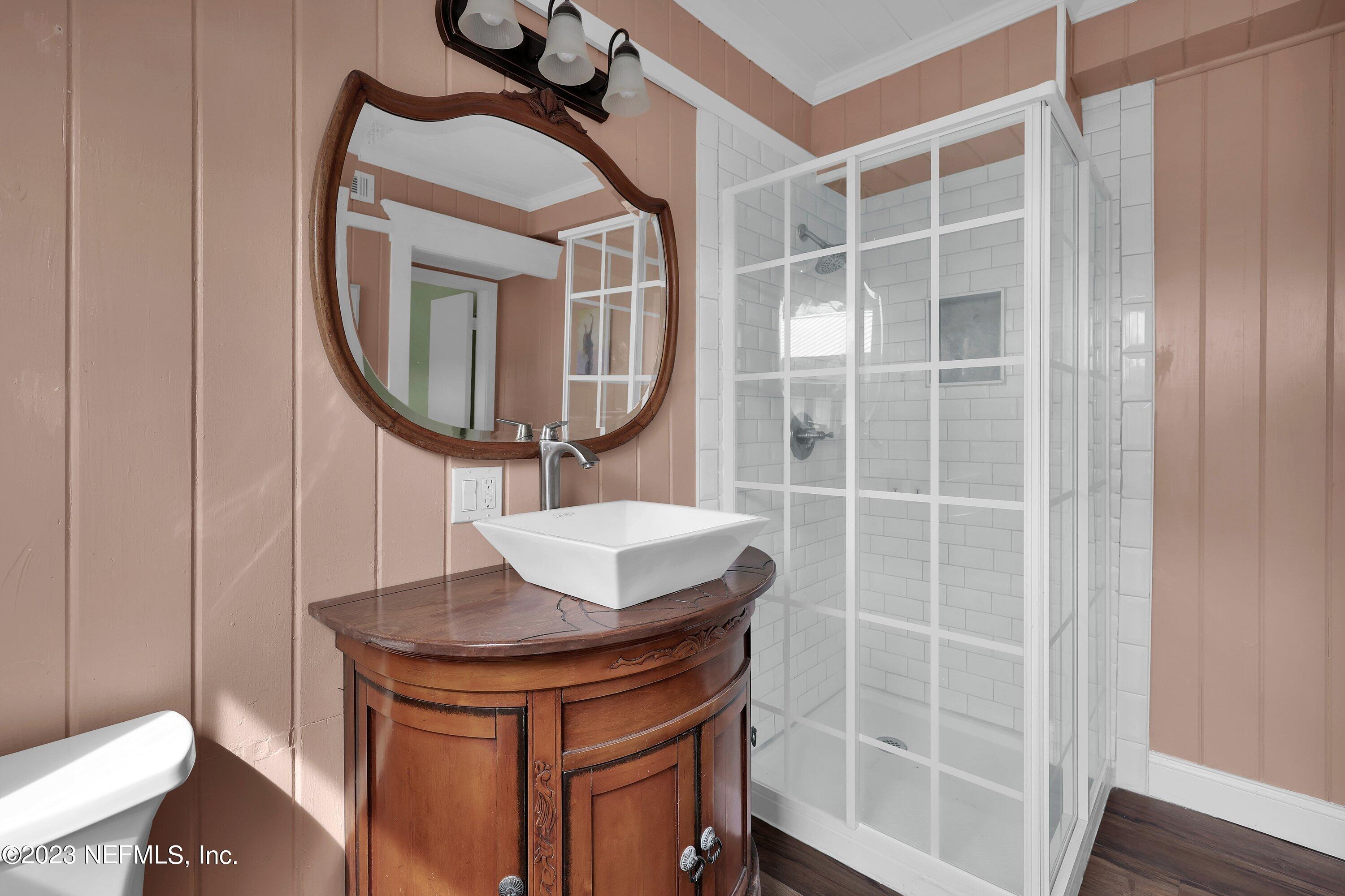 4 Florida Avenue St. Augustine, FL 32084 - Photo 20 of 52 a bathroom with a sink a toilet and a mirror