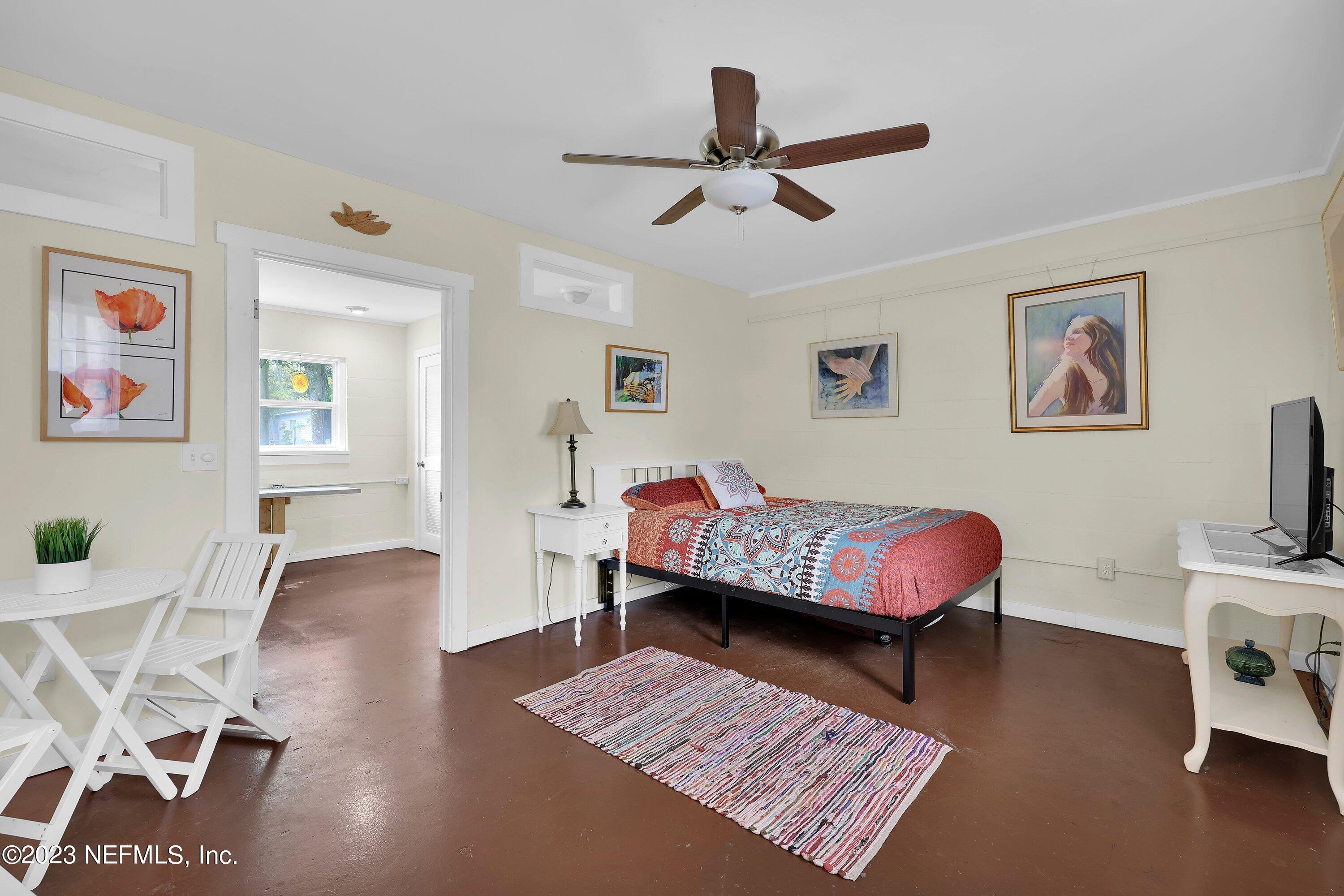 4 Florida Avenue St. Augustine, FL 32084 - Photo 21 of 52 a living room with furniture and a flat screen tv
