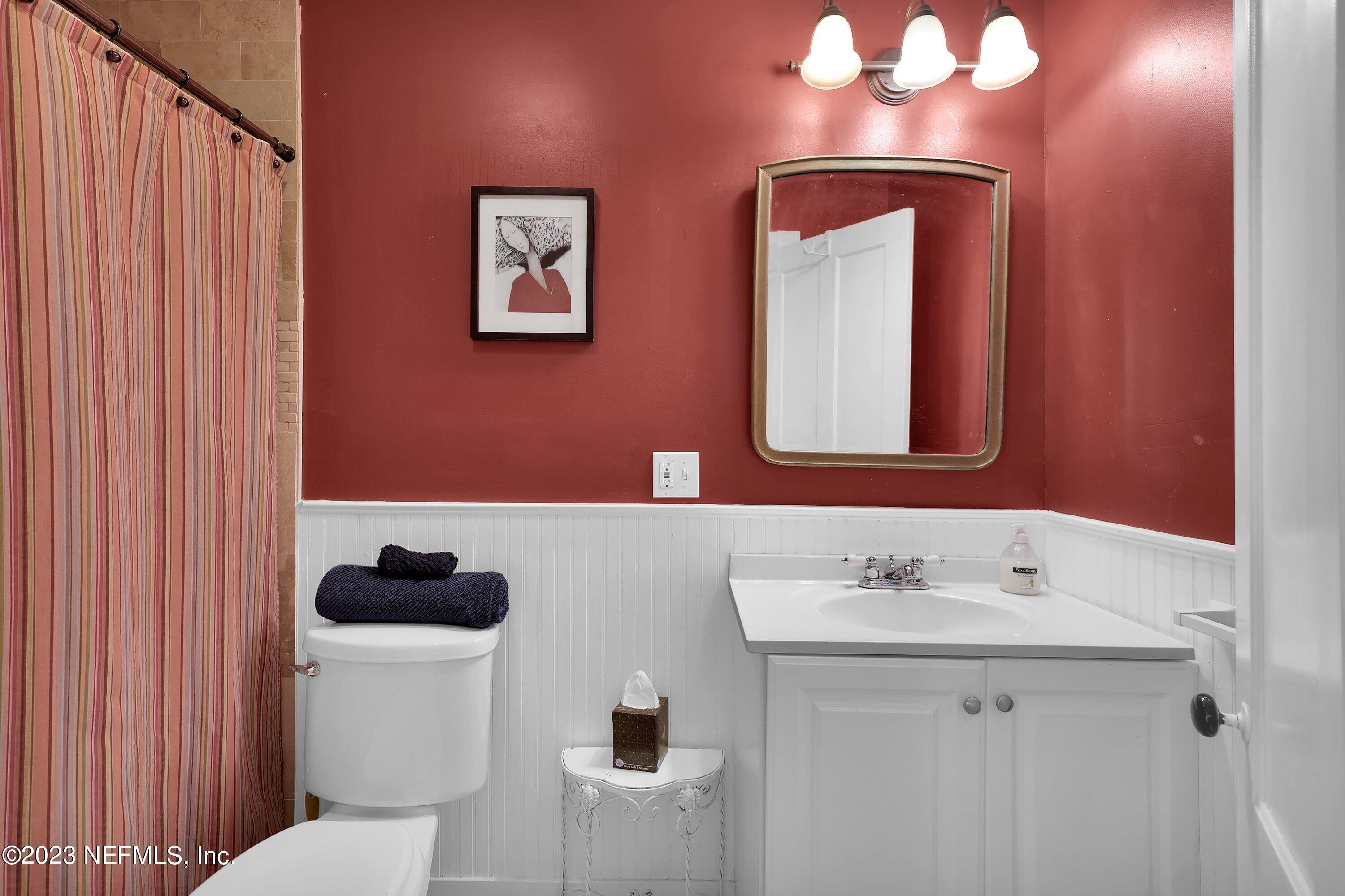 4 Florida Avenue St. Augustine, FL 32084 - Photo 23 of 52 a bathroom with a sink and a mirror