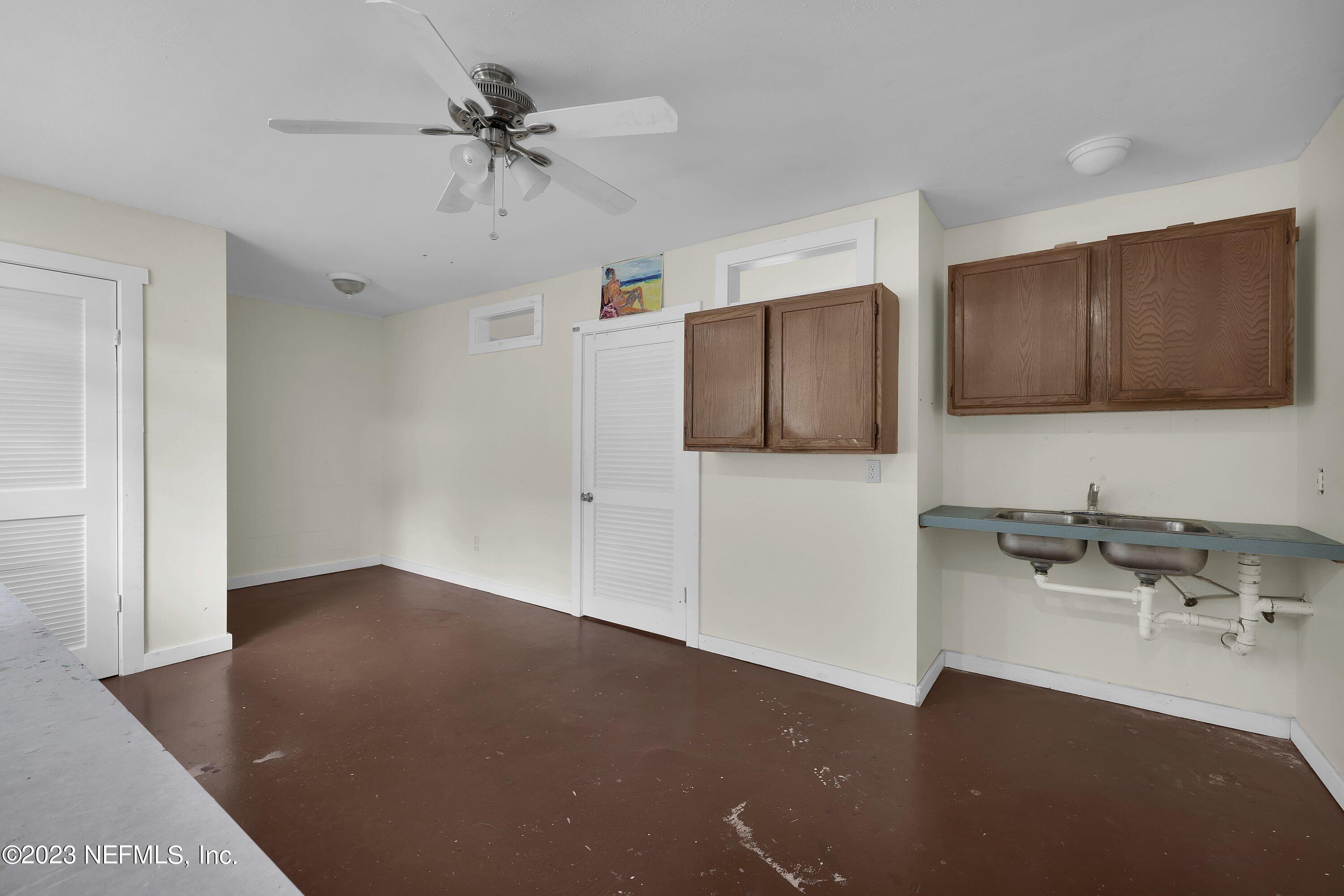 4 Florida Avenue St. Augustine, FL 32084 - Photo 24 of 52 a kitchen with stainless steel appliances a sink stove and refrigerator