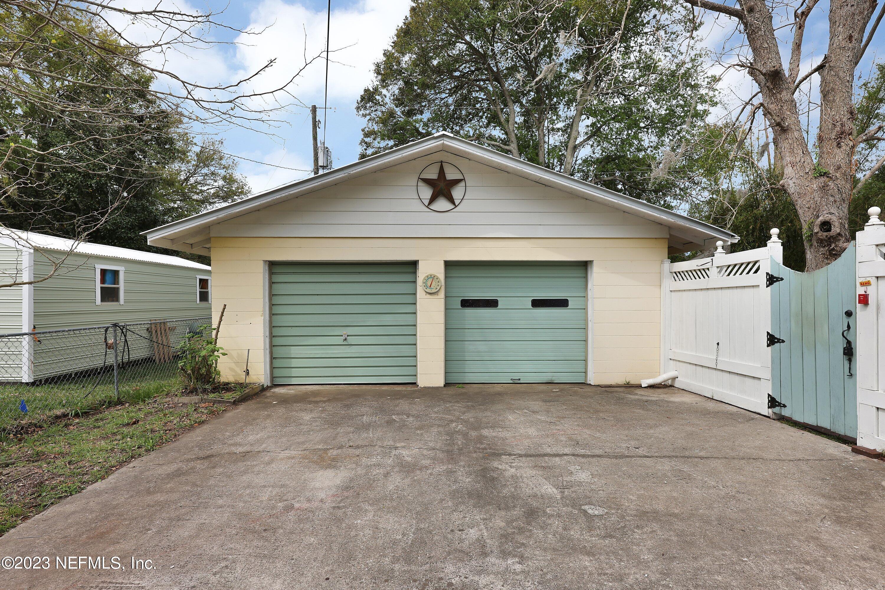4 Florida Avenue St. Augustine, FL 32084 - Photo 28 of 52 a front view of a house with garage