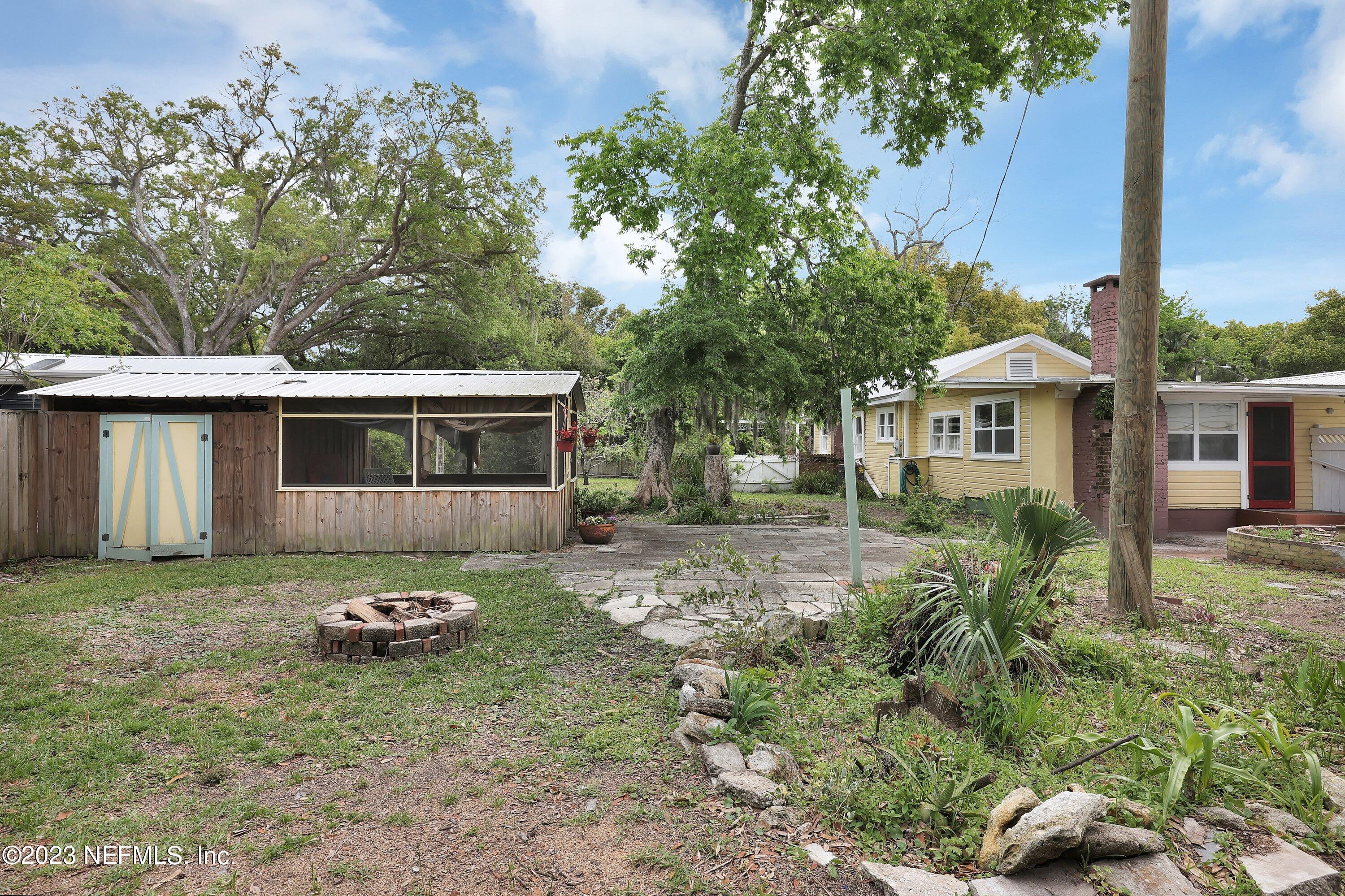 4 Florida Avenue St. Augustine, FL 32084 - Photo 30 of 52 a front view of a house with a garden