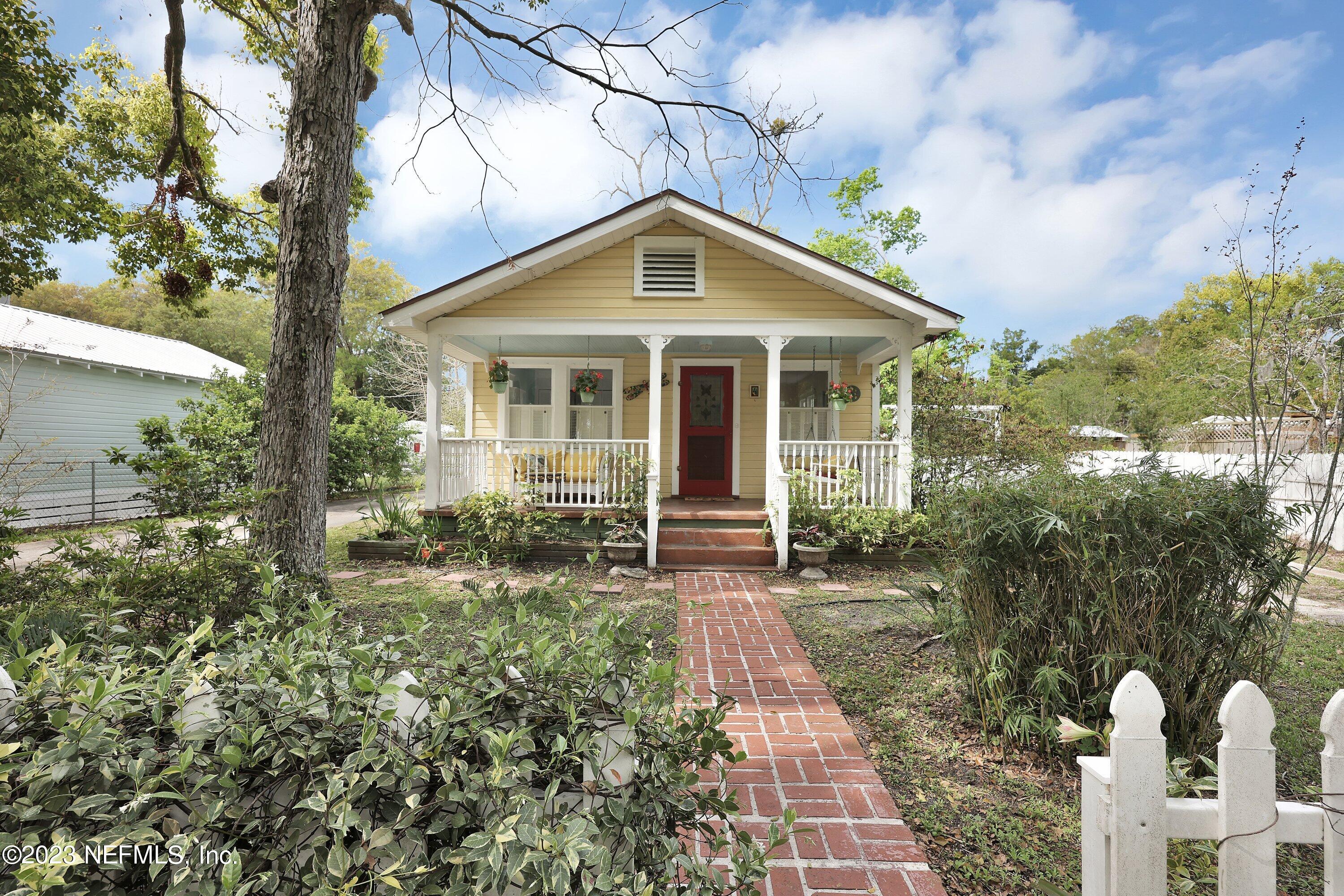 4 Florida Avenue St. Augustine, FL 32084 - Photo 39 of 52 a front view of house with yard and trees around