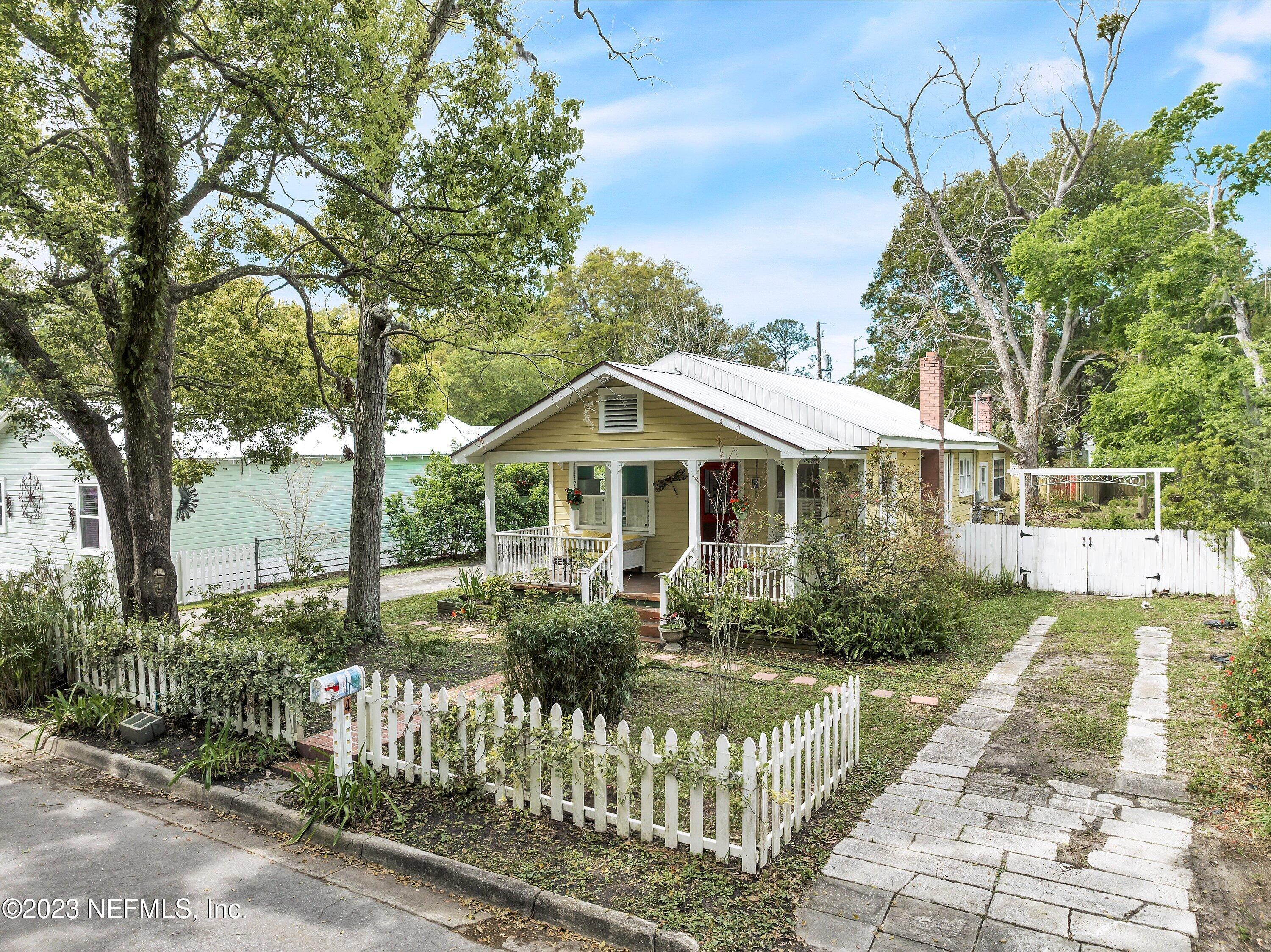 4 Florida Avenue St. Augustine, FL 32084 - Photo 40 of 52 a front view of a house with a garden