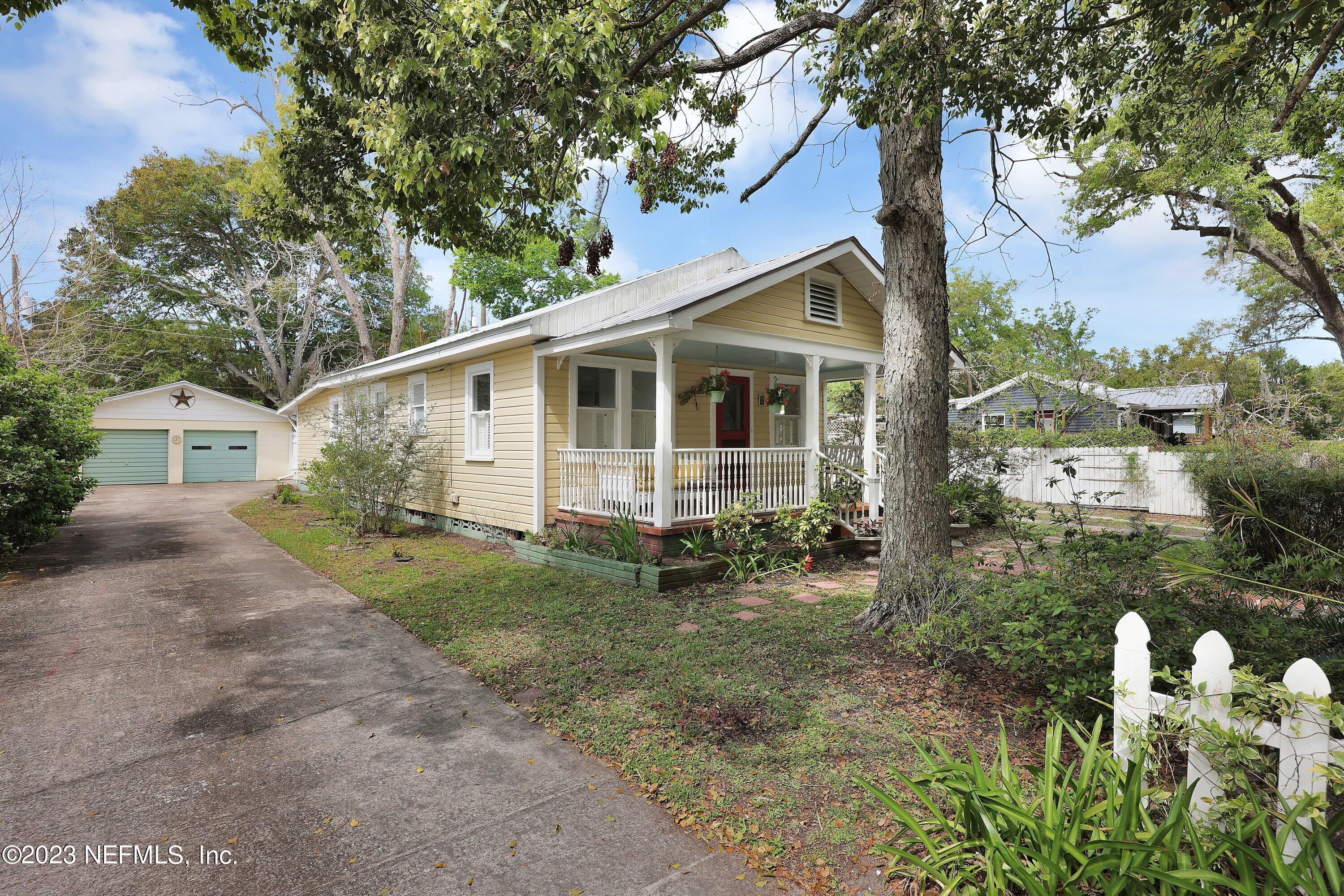 4 Florida Avenue St. Augustine, FL 32084 - Photo 41 of 52 a view of a yard in front of a house with large tree