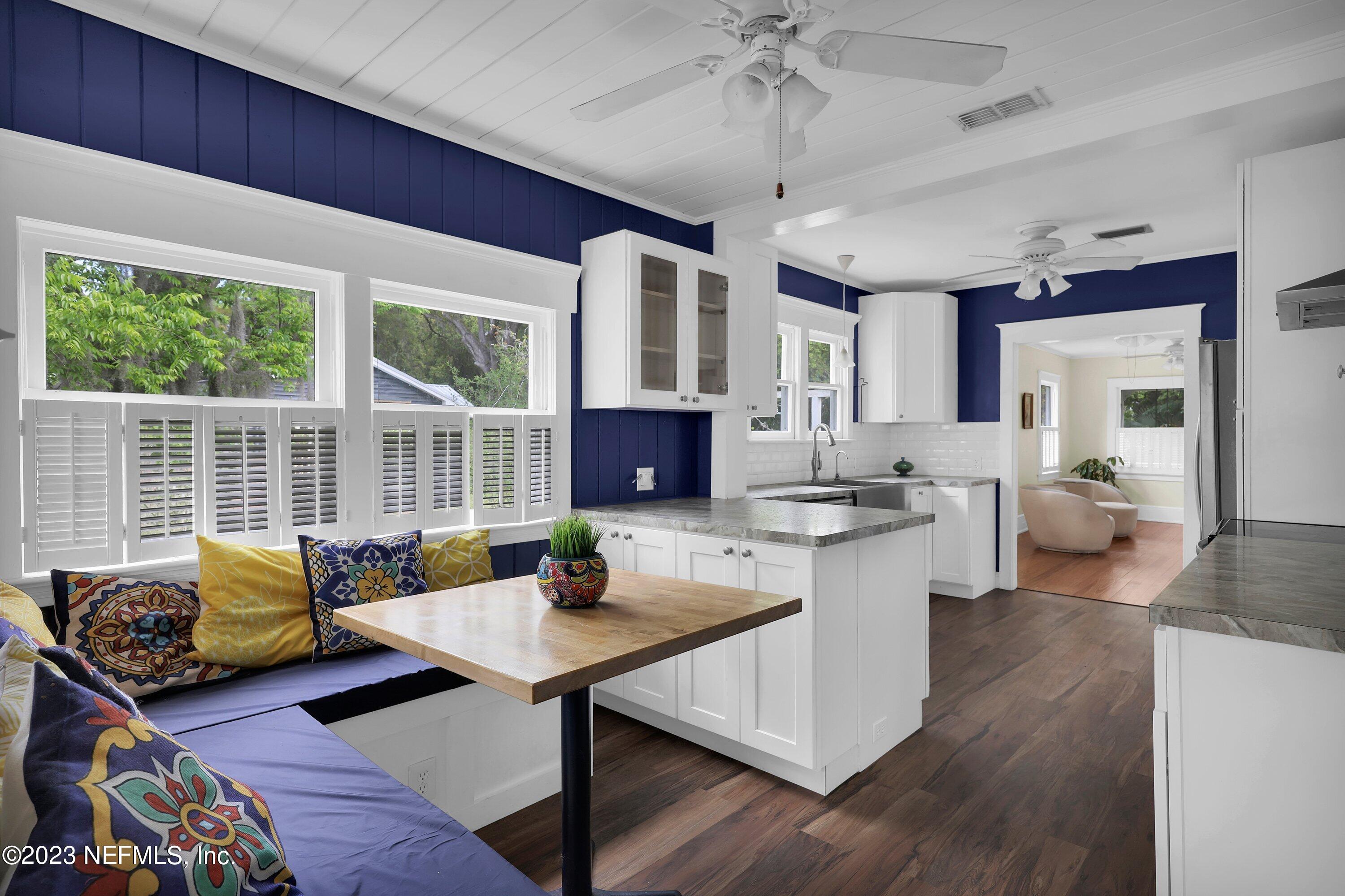 4 Florida Avenue St. Augustine, FL 32084 - Photo 10 of 52 a living room with furniture a flat screen tv and a large window