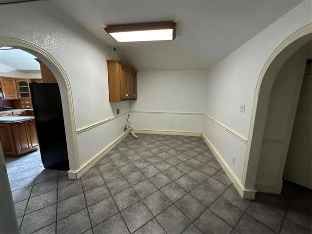 a view of a hardwood floor and staircase