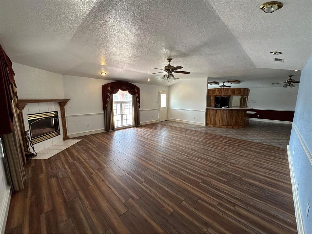 7401 Briar Road Azle, TX 76020 - Photo 4 of 23 a view of empty room with wooden floor