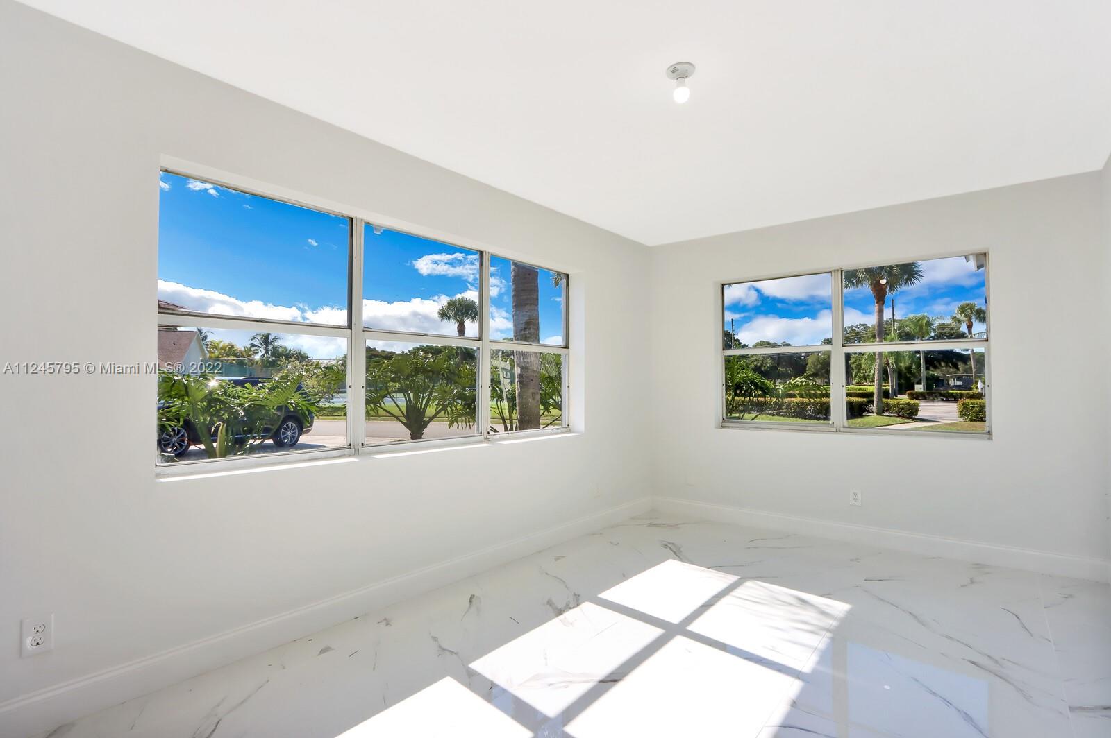 112 Raintree Trail Jupiter, FL 33458 - Photo 22 of 37 a view of an empty room with a window