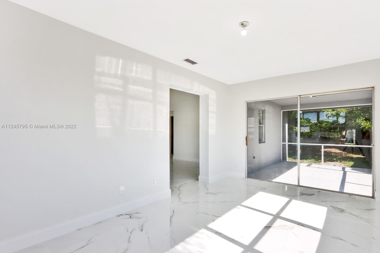 112 Raintree Trail Jupiter, FL 33458 - Photo 23 of 37 a bathroom with a tub and shower