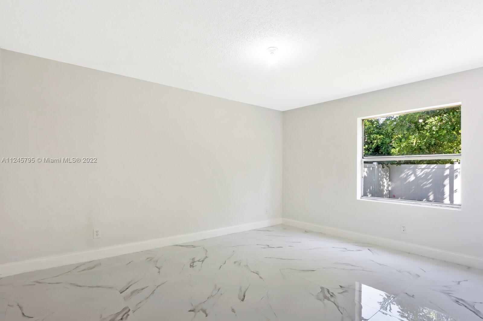 112 Raintree Trail Jupiter, FL 33458 - Photo 28 of 37 an empty room with windows