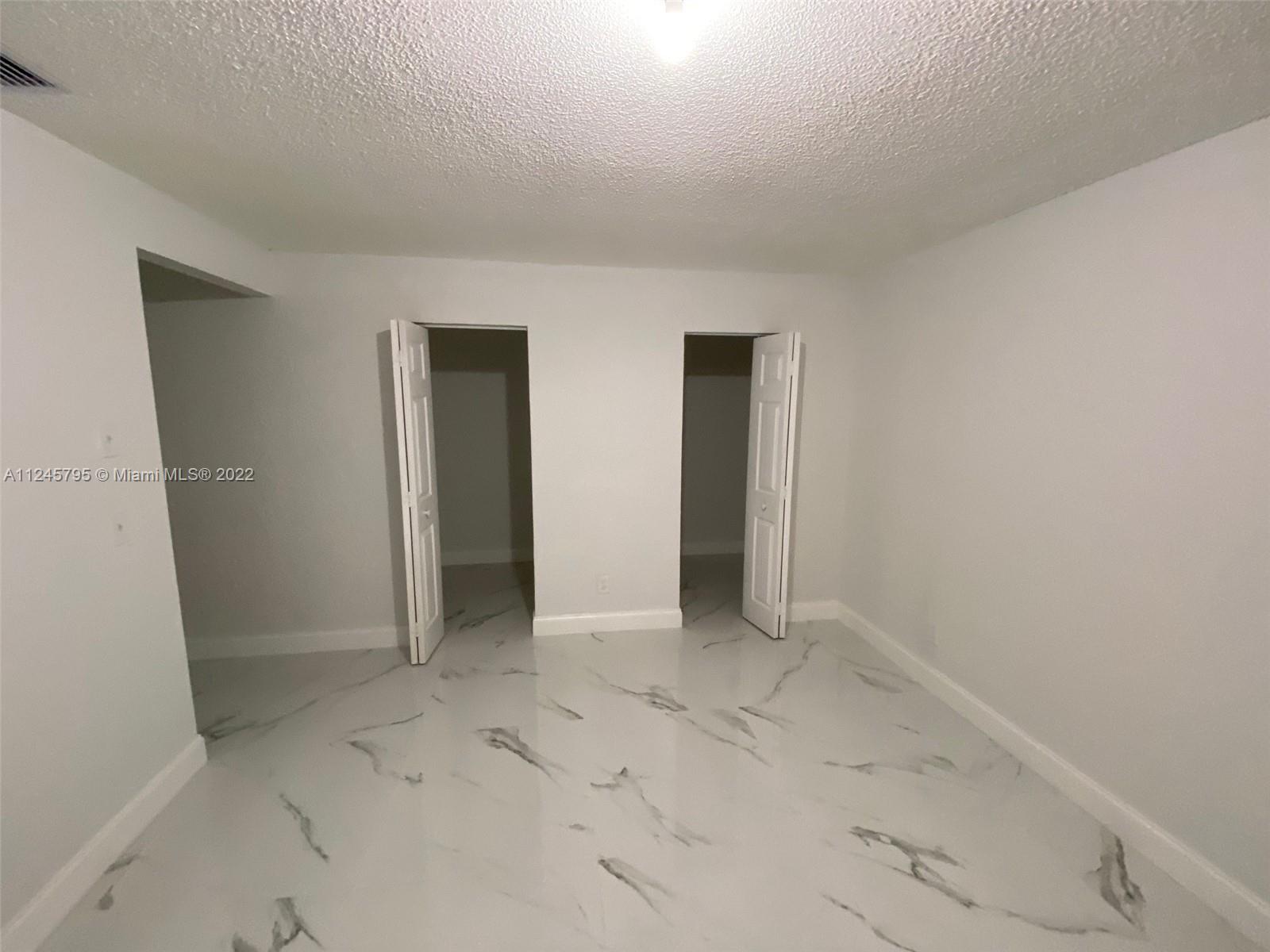 112 Raintree Trail Jupiter, FL 33458 - Photo 31 of 37 an empty room with closet
