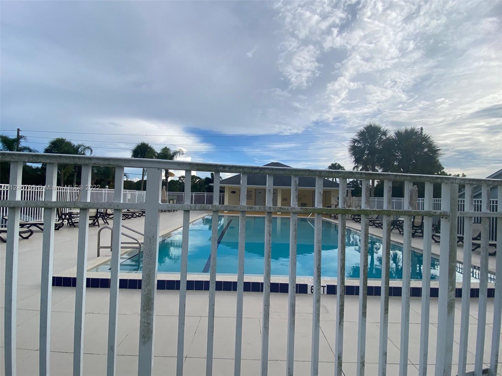 112 Raintree Trail Jupiter, FL 33458 - Photo 36 of 37 a view of house with backyard and porch