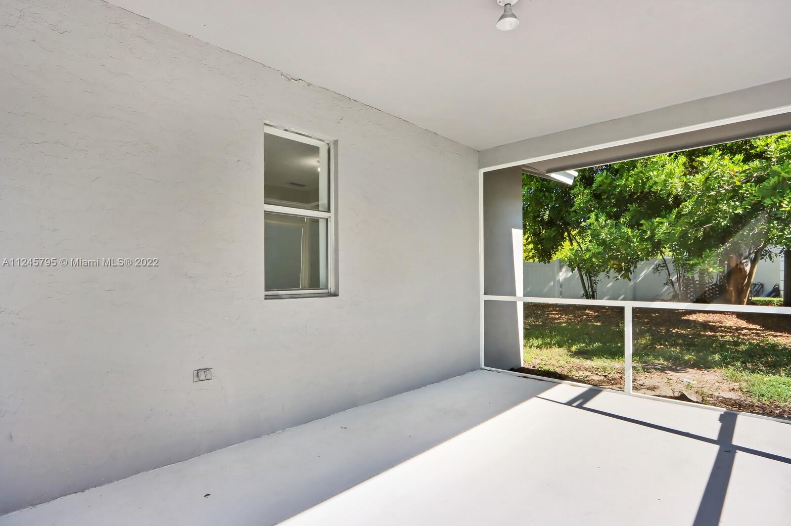 112 Raintree Trail Jupiter, FL 33458 - Photo 9 of 37 a view of a room with a large window