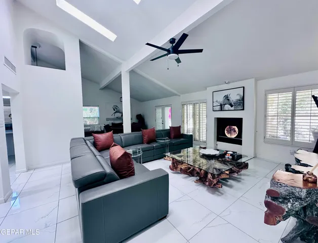 a kitchen with stainless steel appliances kitchen island granite countertop a stove and a sink