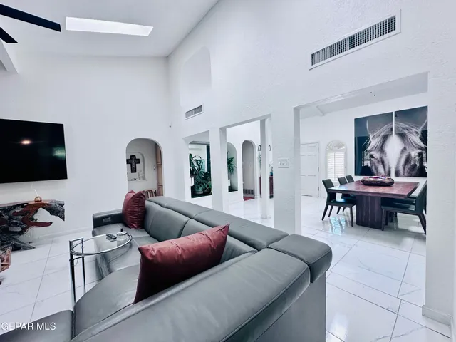 a bathroom with a granite countertop sink toilet and mirror