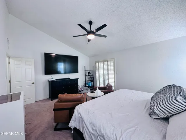 a view of a street with a building in the background