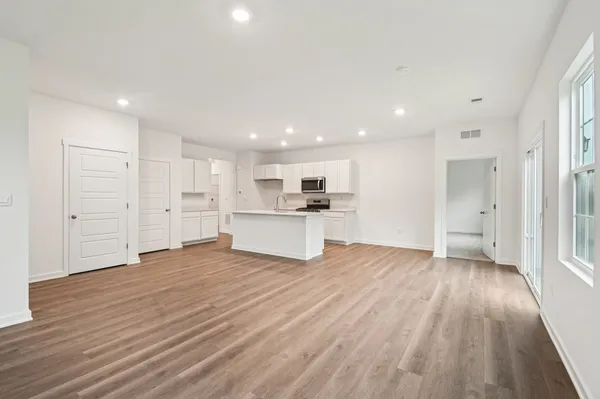 a view of a kitchen with wooden floor