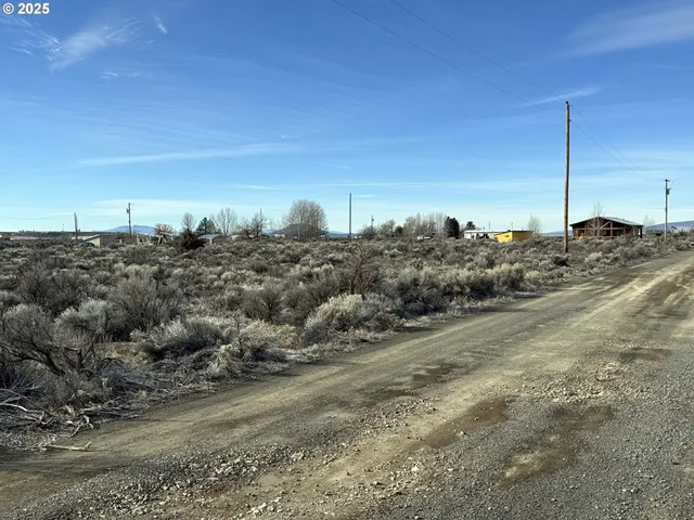 a view of a beach with a view of houses