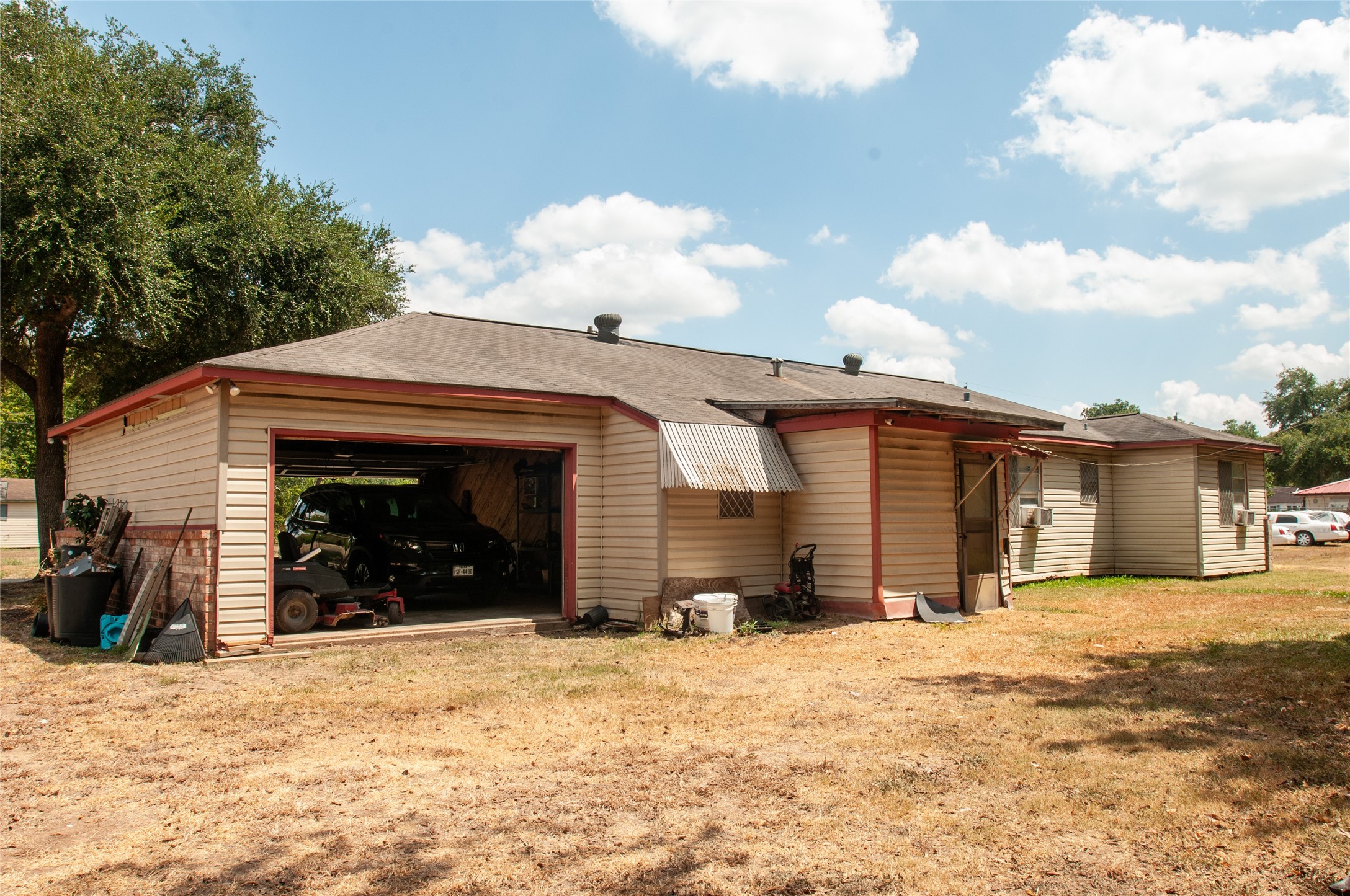 1601 Harris Street Wharton, TX 77488 - Photo 18 of 36 a view of a house with a yard and garage