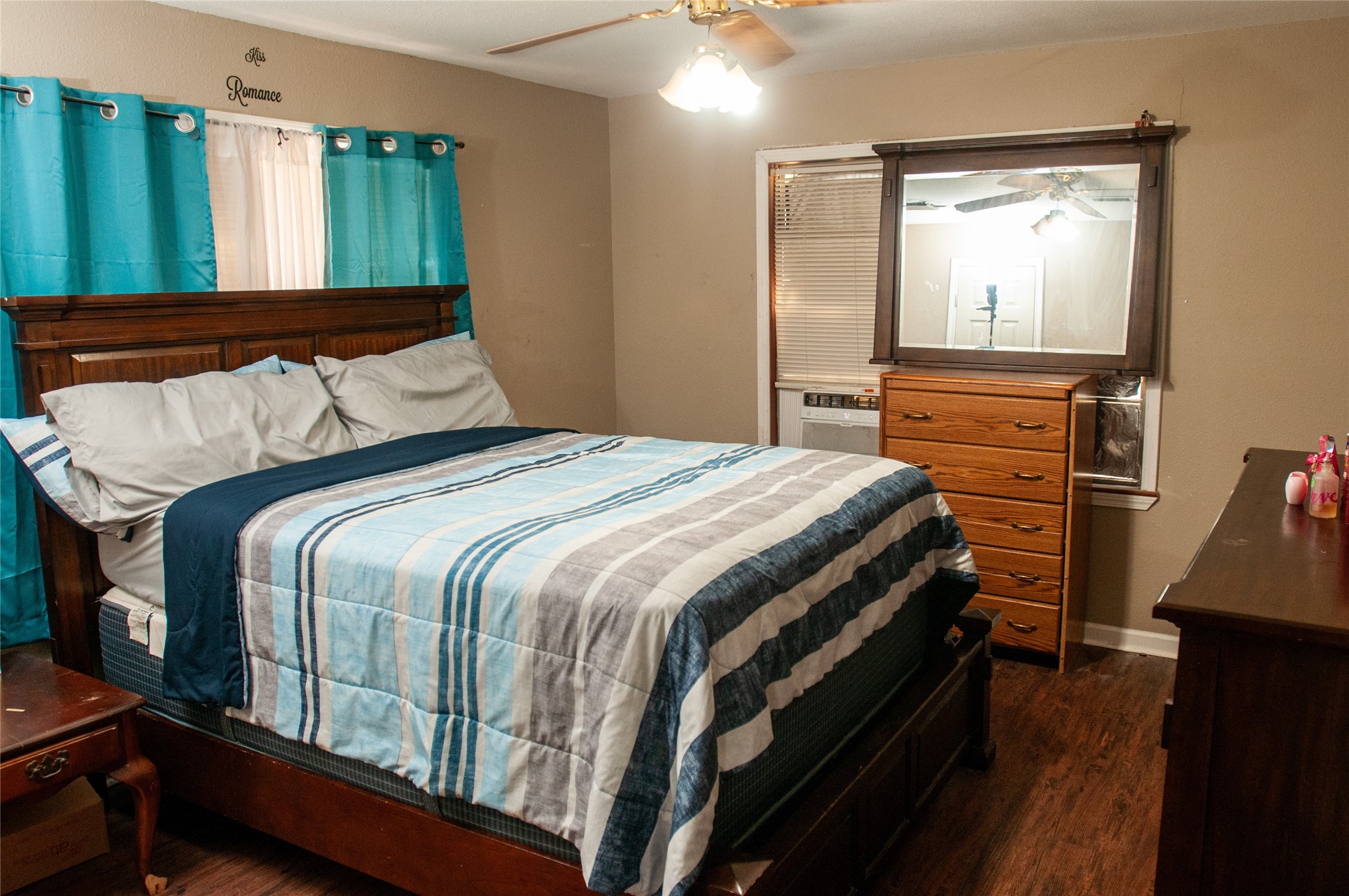 1601 Harris Street Wharton, TX 77488 - Photo 30 of 36 a bedroom with a bed and wooden floor