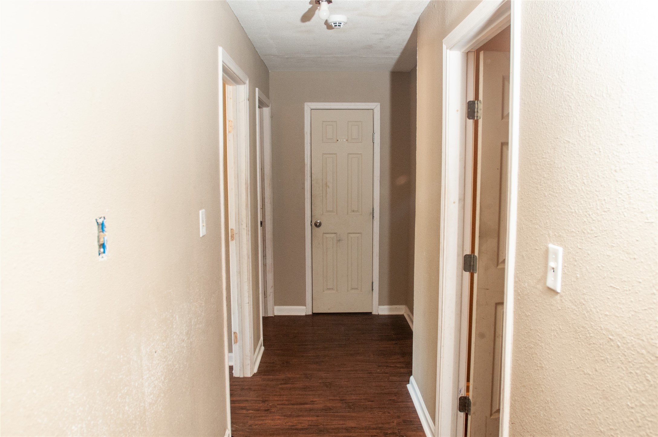 1601 Harris Street Wharton, TX 77488 - Photo 32 of 36 a view of a hallway with wooden floor