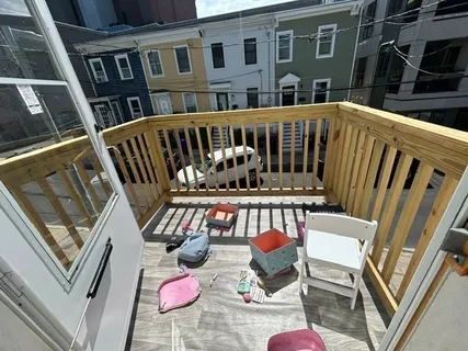 a view of an chairs and table in the balcony
