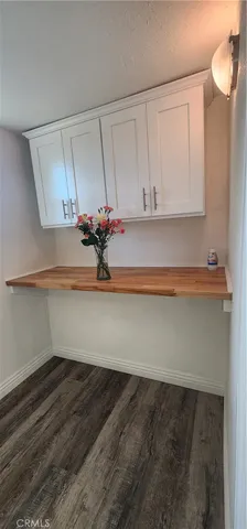 a view of cabinets and wooden floor