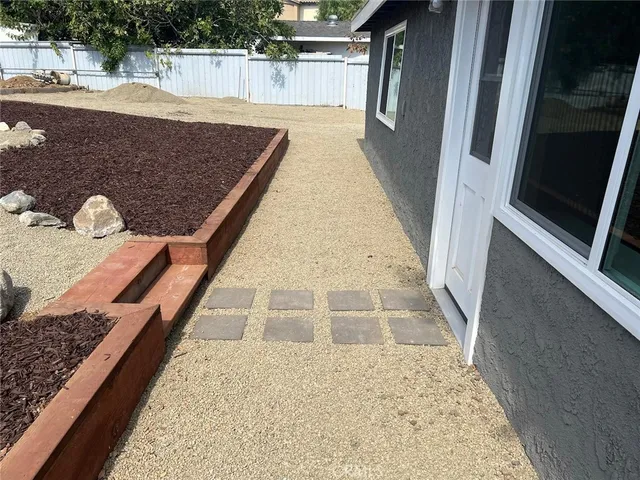a view of a backyard of the house