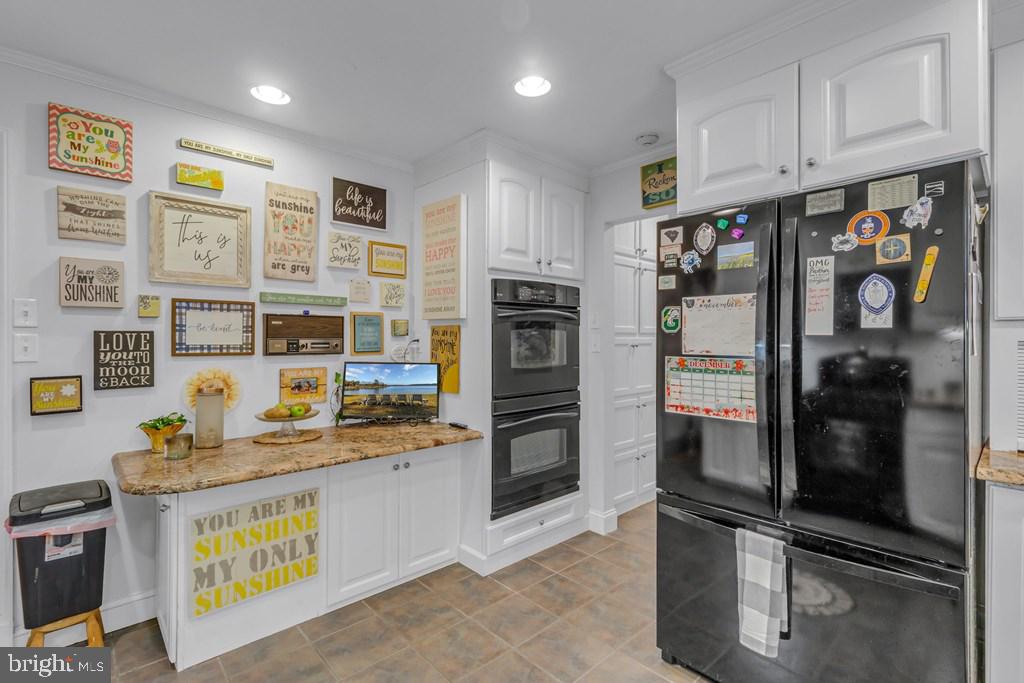 405 Courtney Lane Callao, VA 22435 - Photo 23 of 60 a kitchen with stainless steel appliances granite countertop a refrigerator and a stove