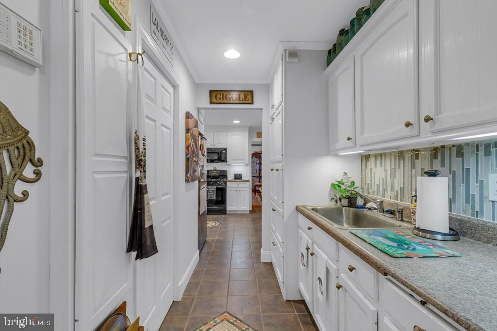 405 Courtney Lane Callao, VA 22435 - Photo 26 of 60 a kitchen with stainless steel appliances granite countertop a refrigerator and a counter top space
