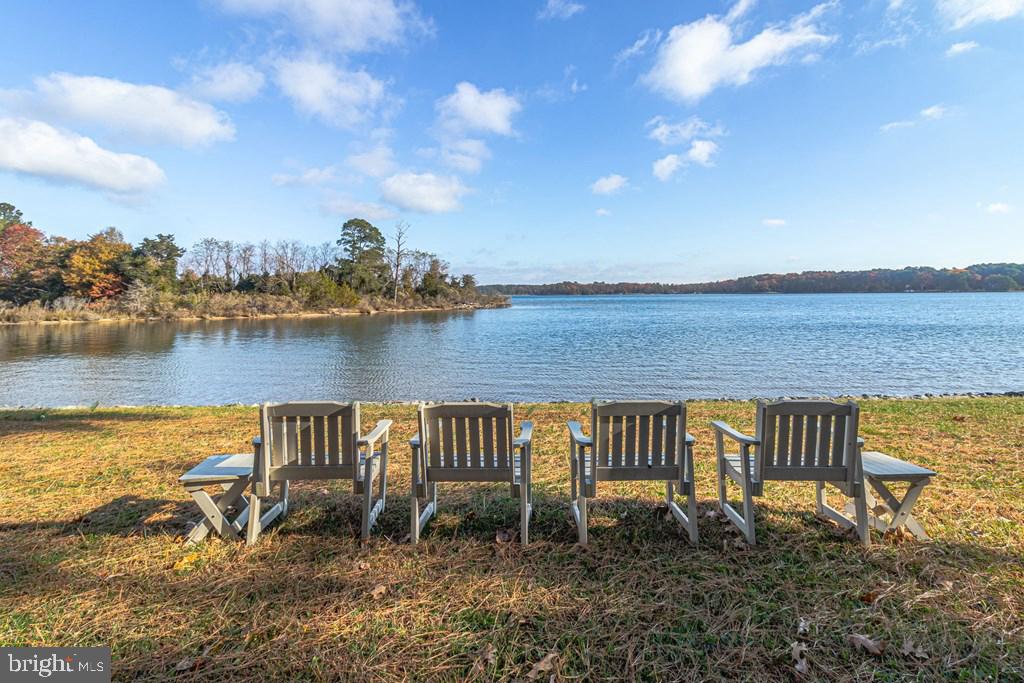 405 Courtney Lane Callao, VA 22435 - Photo 51 of 60 a view of a lake with a house in the background