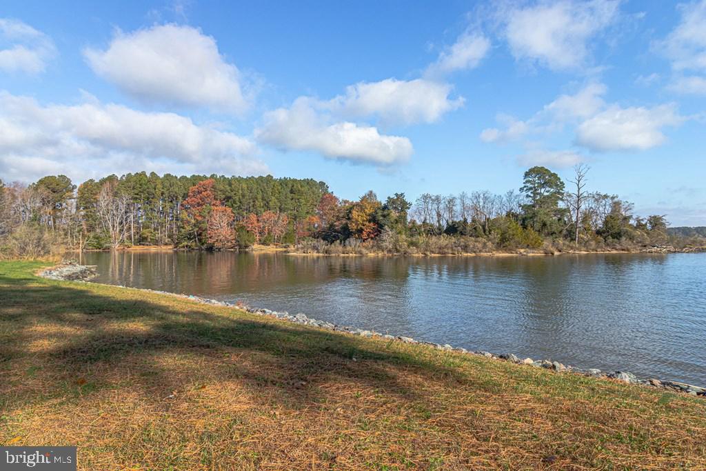 405 Courtney Lane Callao, VA 22435 - Photo 52 of 60 a view of a lake with houses in the back